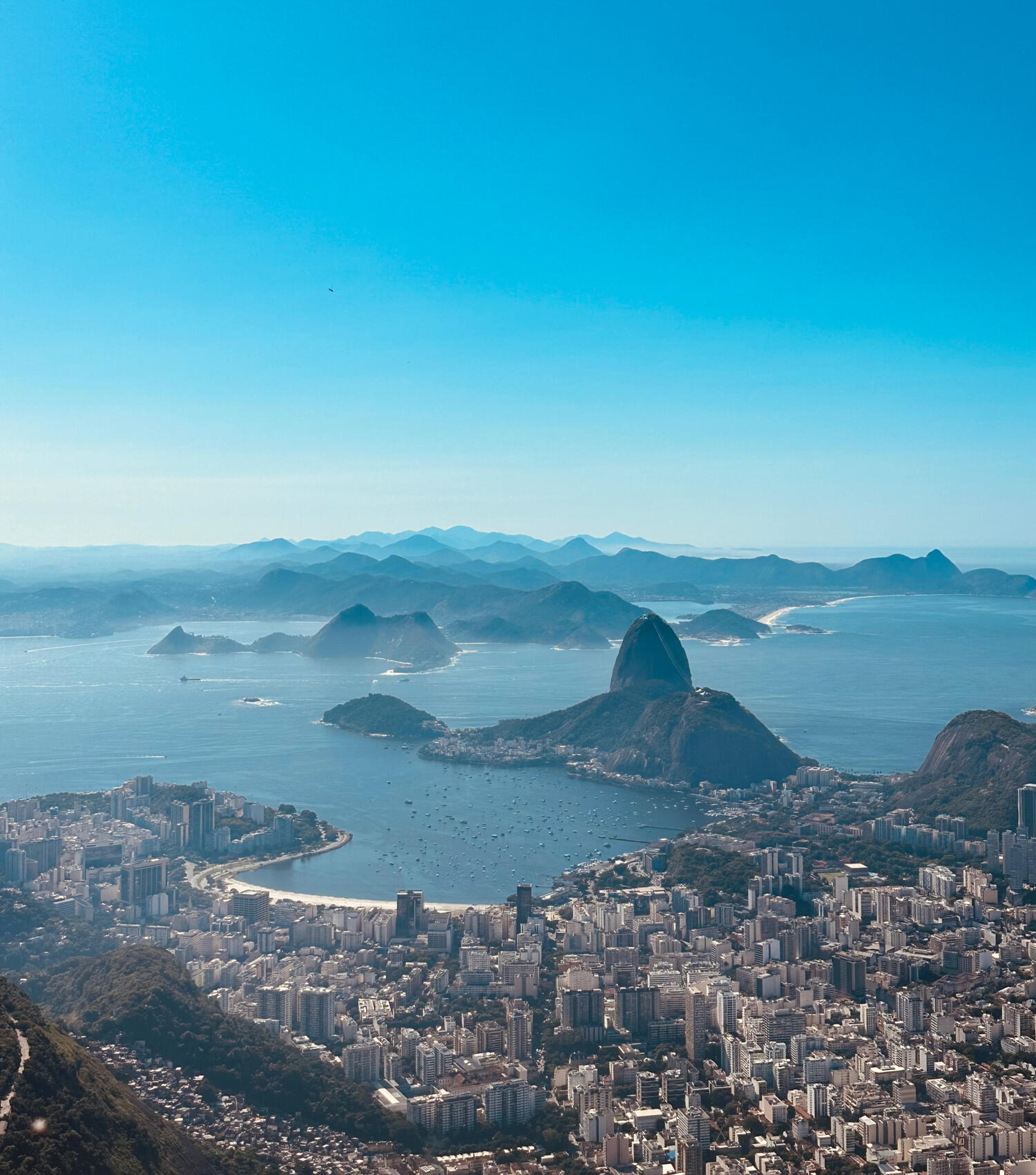 Rio de Janeiro panorama from Christ the Redeemer: Sugar Loaf Mountain, beaches, cityscape, and distant mountains